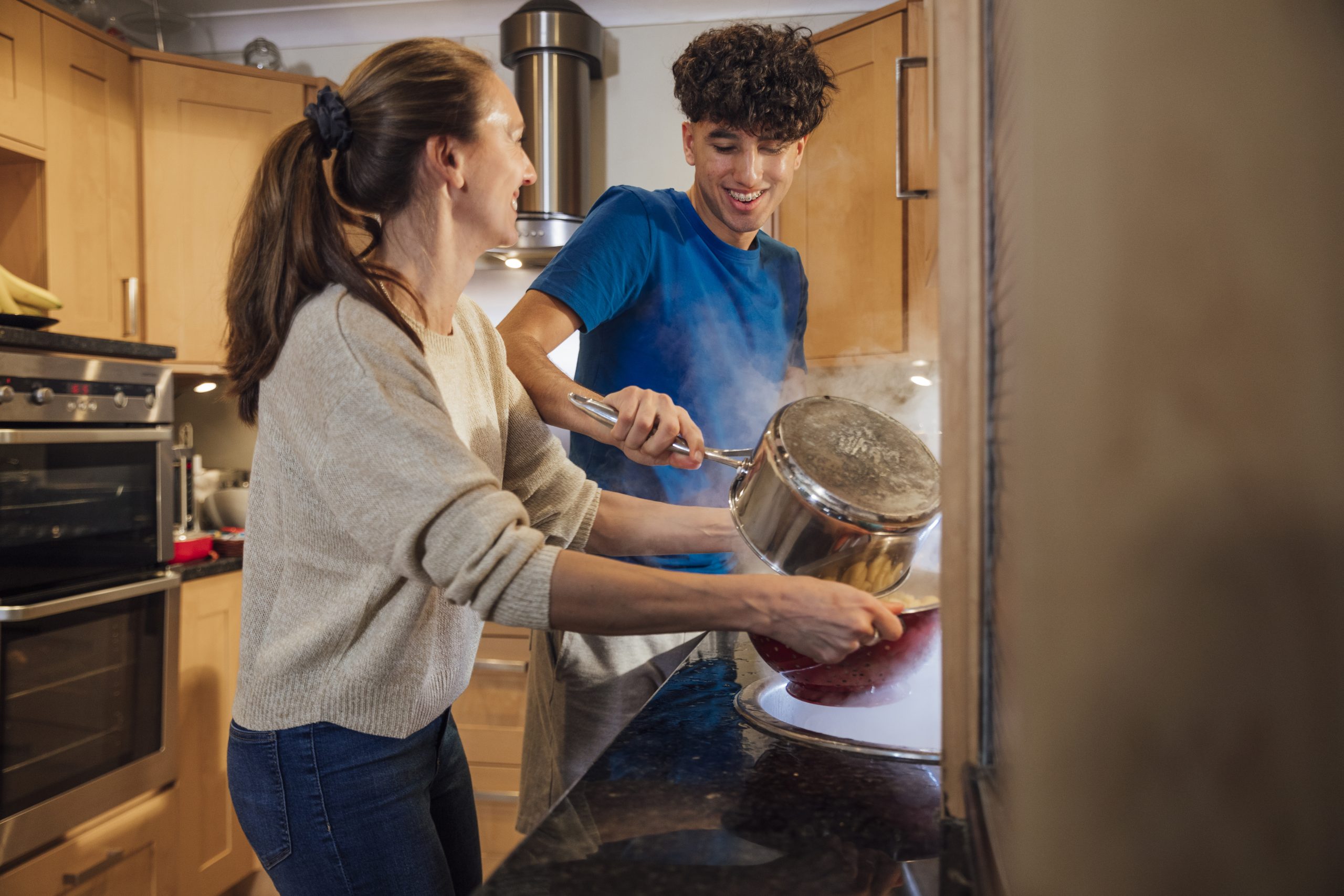 Young person cooking with support